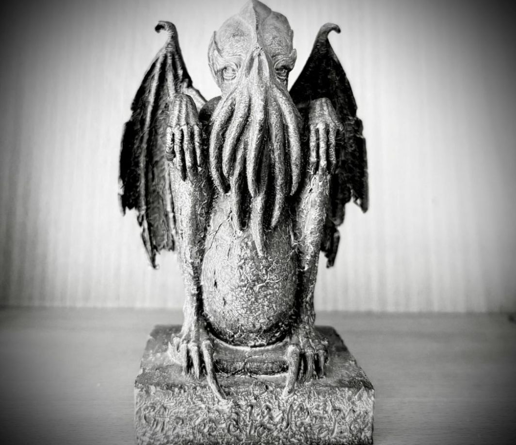 Small figurine with bat wings on a windowsill — symbol for the shadow self